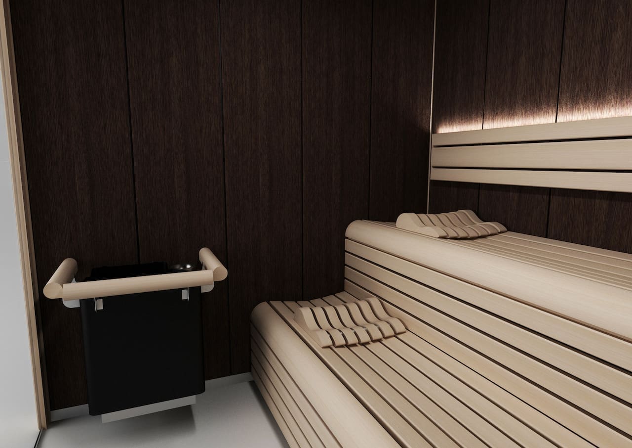 Sauna London con acabado en Wengué con contrastes en color madera, nos adaptamos al espacio del cliente.